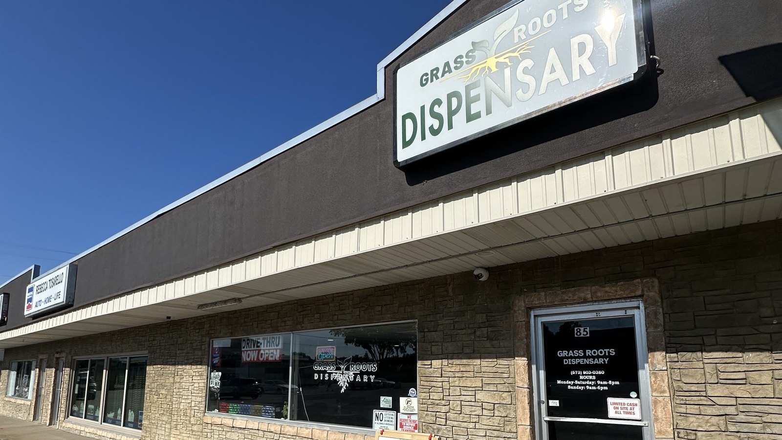 Grass Roots Dispensary storefront on South Plaza Way in Cape Girardeau with the drive-thru sign in the window