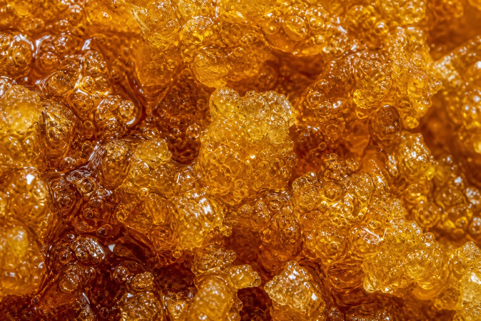 Extreme macro of crystalline THCA sugar in terpene sauce