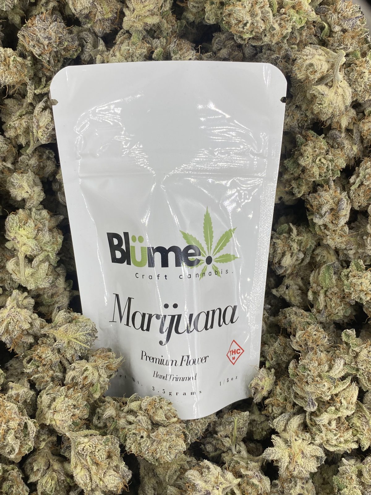 A Blume craft cannabis bag resting on cured flower