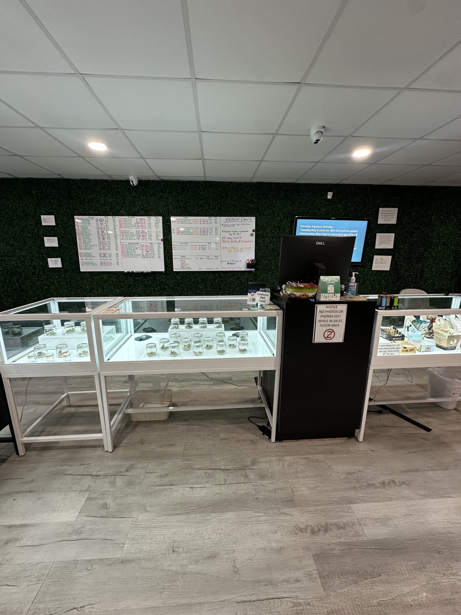 Menu boards and display cases at Grass Roots